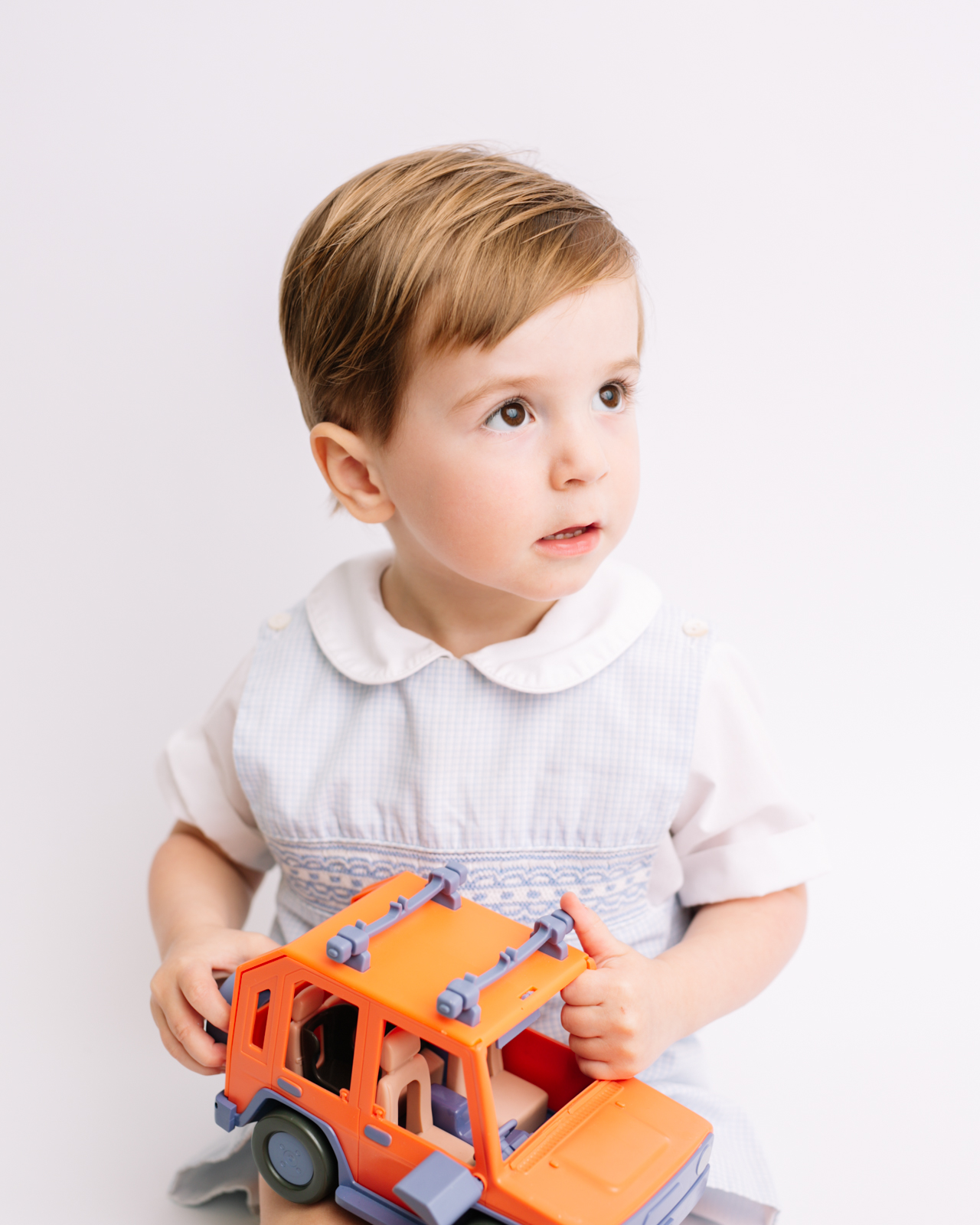 toddler heirloom portrait featuring bluey car